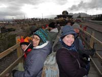 02-all_bundled_up_for_slow_short_train_ride-raining_in_distance-big_storm_front_in_area