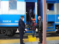 15-Kenny_and_Mommy_stepping_off_the_train