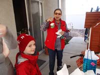 08-Baba_opens_the_present_Kenny_picked_out_at_the_Holiday_Bazaar