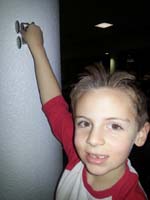 04-playing_with_his_new_car-see_it_even_climbs_a_wall
