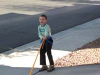 40-rope_fun-Daddy_pulling_Kenny-he's_stuck_to_the_rope_and_can't_get_away
