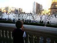 42-watching_the_Bellagio_Fountains-he's_wiggling_his_very_loose_tooth-it_won't_come_out