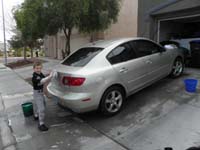 05-Kenny_helping_Daddy_wash_his_car