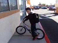 14-Kenny_is_ready_to_ride_his_new_back_from_school_to_home