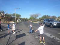 24-Kenny_and_other_kids_help_parents_volunteer_at_race_watering_station