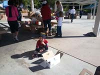 41-Kenny_selling_chocolate_bars_for_Little_League_at_Bountiful_Baskets_pickup_location