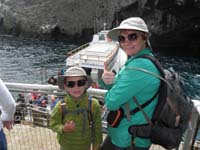 022-Kenny_and_Mommy_give_thumbs_up-took_a_while_to_get_everyone_off_boat-light_waves