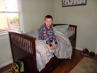 56-Kenny_anxious_to_see_his_Easter_basket_in_the_house_we_rented