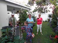 62-hunting_for_Easter_eggs_in_the_rented_house's_backyard