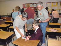 32-Kenny_showing_Baba_and_Poppy_things_in_his_desk