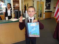 36-Kenny_shows_off_his_Young_Author_story-he_received_3rd_place