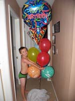 02-Kenny_really_likes_his_balloons-they_were_waiting_right_outside_his_door_when_he_wakes_up