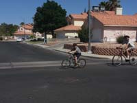13-Kenny_and_Daddy_riding_bikes-Mommy_stages_along_route_for_pictures
