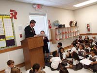 27-Kenny_receives_his_bronze_award_for_Young_Author