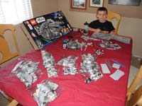 66-Kenny_and_Daddy_started_the_task_of_building_the_Lego_Millenium_Falcon