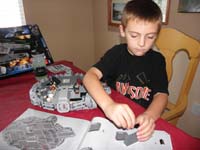 68-working_hard_concentrating-Daddy_found_each_piece_for_each_step-Kenny_put_them_together