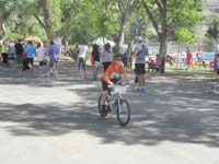 28-Kenny_riding_his_bike-end_of_first_lap-next_time_keep_peddling_fast-although_doing_very_good