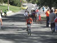 32-here_he_comes_peddling_hard_for_last_lap_for_bike_segment