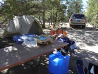 08-relaxing_at_the_campsite-Kenny_taking_a_rest_on_Mommy