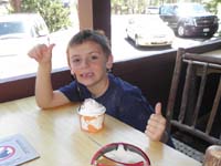 64-Kenny_gives_thumbs_up-well_deserved_big_cup_of_ice_cream-he_ate_it_all