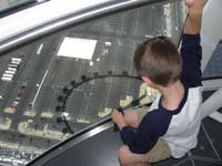 16-Kenny_admiring_the_wheel's_shadow_below-we_are_at_high_point_550_feet_up