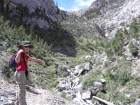 13-Kenny_shows_where_we_need_to_go_next-dry_Big_Falls_in_distance