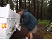 06-everyone_is_wearing_raincoats_to_quickly_setup_the_camper