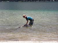 06-Kenny_found_a_tree_to_play_with_in_the_water