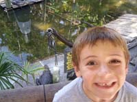 010-alligator_pit-Kenny_had_fun_feeding_them