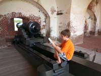 046-sitting_on_a_cannon_working_on_the_program