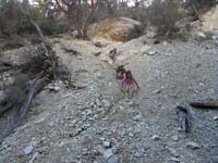 18-scrambling_and_sliding_down_the_slope_from_the_mine_entrance