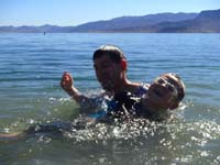 16-Daddy_picking_up_Kenny_to_throw_him-laughing,resisting,got_pissed_afterwards