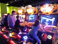 44-Gameworks_fun-Daddy_watches_Kenny_and_Chloe_ride_a_motorcycle
