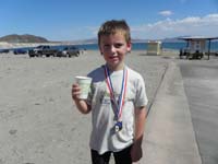 37-Kenny_shows_off_his_medal-now_a_hot_103_degrees