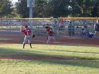 11-backing_up_first_base-Terron_playing_first,Alex_throwing_while_playing_pitcher
