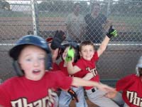 26-Kenny_having_fun_in_the_dugout-Baba_in_background_with_Coach_Tom's_Mom-in_same_Weight_Watchers_class