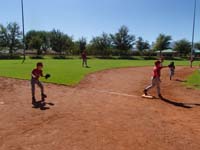 67-Kenny_is_playing_left_field-backing_up_third_baseman,Zachary,who_is_standing_on_base_incorrectly