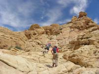 30-time_to_scramble_to_Calico_Tanks_Peak-Kenny_and_Sarah_lead_the_way-with_direction_from_Daddy