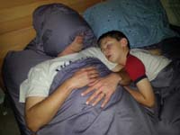 14-Daddy_sleeps_like_this_to_minimize_migraines_since_Mommy_needs_TV_on-Kenny_falls_asleep_in_our_bed