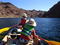 74-floating_down_the_river-Poppy_paddles,Kenny_relaxes