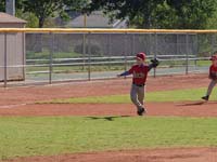27-he_makes_his_move_to_catch_the_ball_hit_towards_him