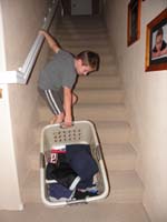 04-Kenny_is_such_a_good_boy-he_even_takes_care_of_putting_away_his_own_laundry-dragging_basket_up_the_stairs