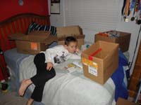 22-packing_his_room_up_since_someone_wants_to_buy_it,but_had_to_stop_to_read