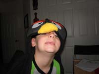23-while_packing,Kenny_rediscovered_his_Bomb_Bird_hooded_towel