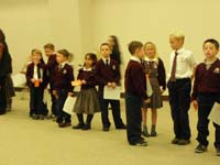 27-Kenny_and_his_class_ready_to_greet_parents_for_Thanksgiving_dinner_in_school_cafeteria
