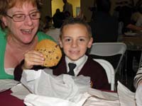 31-Kenny_shows_off_his_dessert_cookie-Grammy_trying_to_take_a_bite-Daddy_tried_to_steal_it
