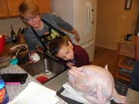 37-time_to_prepare_Thanksgiving_dinner-Kenny_checks_out_inside_of_turkey