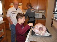38-Kenny_is_entralled_with_the_cavernous_turkey_interior-'it's_like_a_cave,a_spooky_cave'