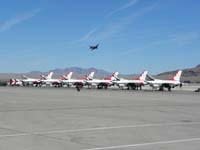056-F8F_Bearcat_flying_by_with_Thunderbirds_on_ground-old,new