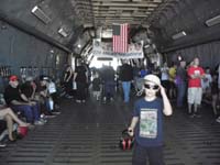 063-Kenny_inside_cargo_hold-line_too_long_to_go_up_into_cockpit